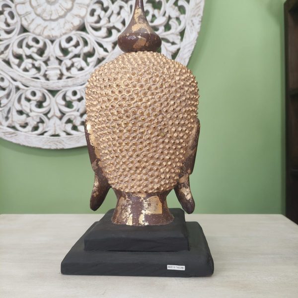 scultura testa di buddha in legno con foglia d'oro