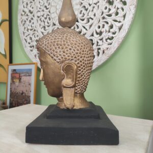 profilo di testa in legno del buddha colore oro