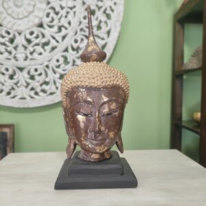 statue testa di buddha dorata