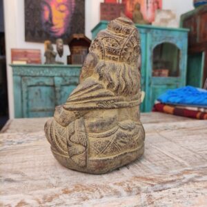 statua artigianale divinità ganesh con libro